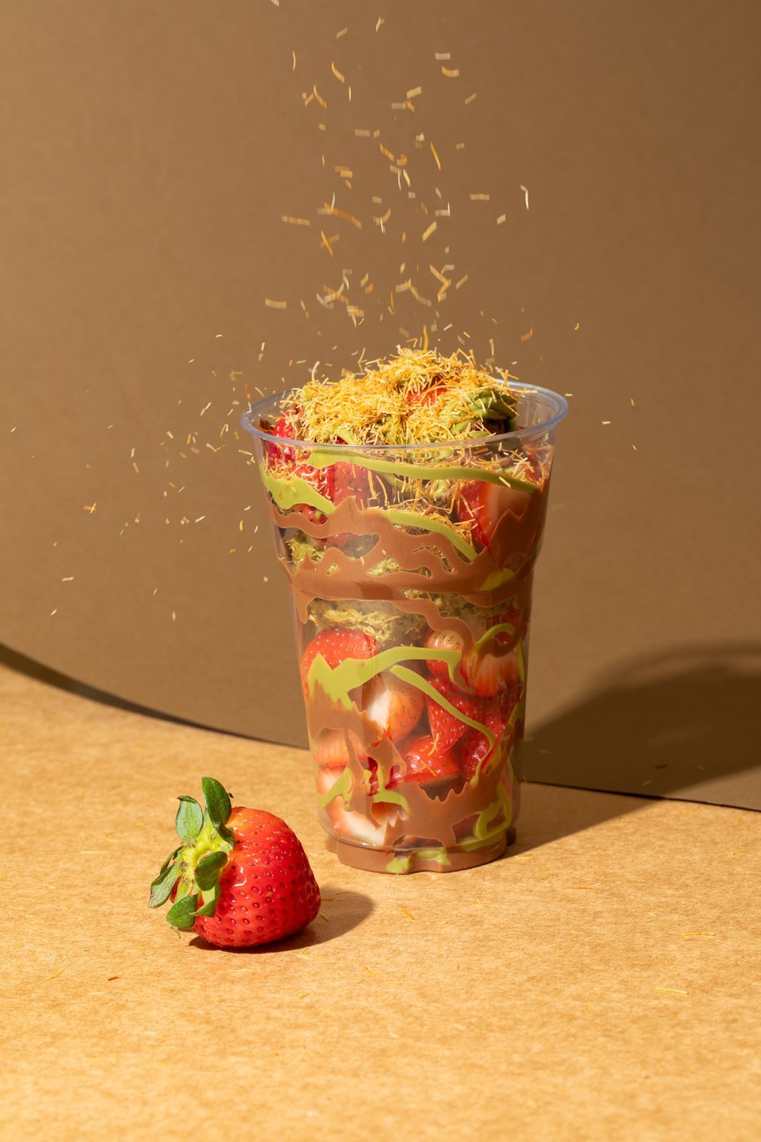 Strawberry cup with falling kunefe